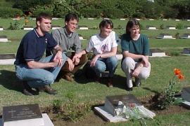 at their grandfather's grave